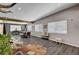 Bright, open-concept living room featuring modern decor, wood-style floors, and ample natural light at 3013 Roseville Way, Las Vegas, NV 89102