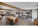 Open-concept living space with a kitchen island, dining table, and modern decor at 3013 Roseville Way, Las Vegas, NV 89102