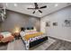 A comfy main bedroom with a ceiling fan, decorative lamps, and a decorative chair at 3013 Roseville Way, Las Vegas, NV 89102