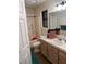 Functional bathroom with a shower-tub combo, single sink vanity, and neutral wall color at 3051 S Rainbow Ave, Pahrump, NV 89048