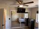 Bedroom featuring hardwood floors, closet, and mounted television at 3051 S Rainbow Ave, Pahrump, NV 89048