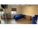 Bedroom featuring hardwood floors, refrigerator, and dresser at 3051 S Rainbow Ave, Pahrump, NV 89048