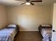 Bedroom featuring hardwood floors and twin beds at 3051 S Rainbow Ave, Pahrump, NV 89048