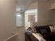 Entryway featuring hardwood floors and view into living room at 3051 S Rainbow Ave, Pahrump, NV 89048