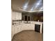 Modern kitchen with white cabinets, stainless steel appliances, and sleek countertops at 3051 S Rainbow Ave, Pahrump, NV 89048