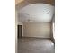 Spacious living room with vaulted ceiling, neutral walls, and wood-look flooring at 3051 S Rainbow Ave, Pahrump, NV 89048