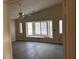 Bright living room featuring hardwood flooring and bay window at 3051 S Rainbow Ave, Pahrump, NV 89048