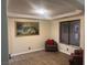 Inviting living room featuring a neutral color palette and wood-look flooring for a warm ambiance at 3051 S Rainbow Ave, Pahrump, NV 89048