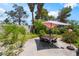 Backyard patio area with table, chairs, and landscaping at 3200 Mariner Bay St, Las Vegas, NV 89117