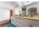 Bathroom with double sinks, large mirrors, and walk-in shower at 3200 Mariner Bay St, Las Vegas, NV 89117