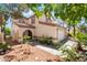 Charming home with stucco and desert landscaping; entryway with portico and attached garage at 3200 Mariner Bay St, Las Vegas, NV 89117