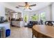 Bright kitchen with white cabinetry, modern appliances, and a cozy breakfast nook area at 3200 Mariner Bay St, Las Vegas, NV 89117