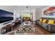 Bright living room with hardwood floors, neutral walls, large windows, and contemporary furnishings at 3200 Mariner Bay St, Las Vegas, NV 89117