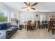 Bright living room with tile floors, neutral walls, multiple windows and modern ceiling fan at 3200 Mariner Bay St, Las Vegas, NV 89117