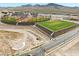 Aerial view of sports park featuring baseball fields and well-maintained green spaces for recreational activities at 3369 Ponicelli Ln, Henderson, NV 89044