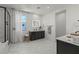 Bright bathroom with marble floors, black vanity, and modern finishes, creating a clean and stylish space at 3369 Ponicelli Ln, Henderson, NV 89044