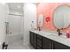 Stylish bathroom features double vanity, modern fixtures, framed mirrors, and shower over tub at 3369 Ponicelli Ln, Henderson, NV 89044