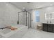 Bright bathroom featuring a tub, separate glass shower, and modern vanity, creating a serene and functional space at 3369 Ponicelli Ln, Henderson, NV 89044