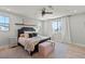 Bright bedroom featuring wood floors, large windows and a cozy bed at 3369 Ponicelli Ln, Henderson, NV 89044