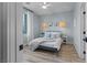 Airy bedroom with accent lighting, a cozy bed, and soft curtains at 3369 Ponicelli Ln, Henderson, NV 89044