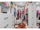 Spacious walk-in closet featuring a variety of shelving, drawers, and hanging space to maximize storage at 3369 Ponicelli Ln, Henderson, NV 89044