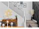 Elegant foyer with stylish staircase and decorative elements at 3369 Ponicelli Ln, Henderson, NV 89044