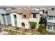 Exterior of a modern two-story home boasting a tiled roof, neutral color scheme, and manicured landscaping at 3369 Ponicelli Ln, Henderson, NV 89044