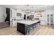 Open kitchen with a large marble island, stainless steel appliances, and eat in seating at 3369 Ponicelli Ln, Henderson, NV 89044