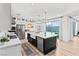 Modern kitchen features stainless appliances, large island, and sliding doors leading to the outdoor space at 3369 Ponicelli Ln, Henderson, NV 89044