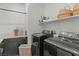 Functional laundry room features modern machines, storage, and ample counter space at 3369 Ponicelli Ln, Henderson, NV 89044