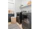 Functional laundry room features modern machines, storage, and ample counter space at 3369 Ponicelli Ln, Henderson, NV 89044
