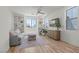 Inviting living room with ample light, wood floors, and custom built-in shelving at 3369 Ponicelli Ln, Henderson, NV 89044