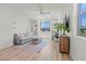 Inviting living room with ample light, wood floors, and custom built-in shelving at 3369 Ponicelli Ln, Henderson, NV 89044