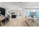 Bright, open-concept living space flows into the kitchen and features a view of the backyard and pool at 3369 Ponicelli Ln, Henderson, NV 89044