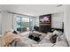 Stylish living room with fireplace, large sliding doors, and a view of the backyard swimming pool at 3369 Ponicelli Ln, Henderson, NV 89044