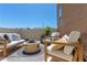 Relaxing patio area complete with comfortable seating and a cozy fire pit at 3369 Ponicelli Ln, Henderson, NV 89044