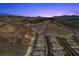 Stunning aerial view of an upscale neighborhood surrounded by desert landscape at 34 Costa Tropical Dr, Henderson, NV 89011