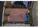 Real estate aerial view highlighting the home's red tile roof, pool, landscaping, and fire feature at 34 Costa Tropical Dr, Henderson, NV 89011