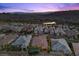 Scenic aerial view of residential neighborhood nestled between a mountain and a nearby lake at 34 Costa Tropical Dr, Henderson, NV 89011