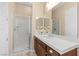 Bright bathroom featuring a glass-enclosed shower and modern vanity with a white countertop at 34 Costa Tropical Dr, Henderson, NV 89011