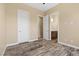 Neutral toned bedroom showcasing a variety of entry points and decorative flooring at 34 Costa Tropical Dr, Henderson, NV 89011