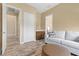 Bonus room featuring hardwood floors, comfortable seating, and a convenient wet bar area at 34 Costa Tropical Dr, Henderson, NV 89011