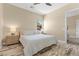 Main bedroom featuring hardwood floors, neutral decor, a comfortable bed, and ample natural light at 34 Costa Tropical Dr, Henderson, NV 89011