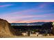 Scenic view of the city lights from the mountains with a colorful evening sky at 34 Costa Tropical Dr, Henderson, NV 89011