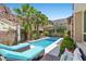 Private pool with lounge chairs and views of desert landscape, offering a tranquil outdoor oasis for relaxation and recreation at 34 Costa Tropical Dr, Henderson, NV 89011