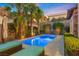 Private pool featuring modern design, surrounded by lush palm trees and landscape, lounge seating at 34 Costa Tropical Dr, Henderson, NV 89011