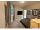 Inviting bedroom with gray walls, a comfy bed, and natural light at 3447 Sw Covilha Ln, Henderson, NV 89044