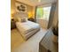 Comfortable bedroom with neutral tones, large window and stylish decor at 3447 Sw Covilha Ln, Henderson, NV 89044