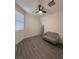 Bright bedroom featuring a window and a cozy couch at 3447 Sw Covilha Ln, Henderson, NV 89044