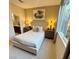 Comfortable bedroom with neutral tones, large window and stylish decor at 3447 Sw Covilha Ln, Henderson, NV 89044